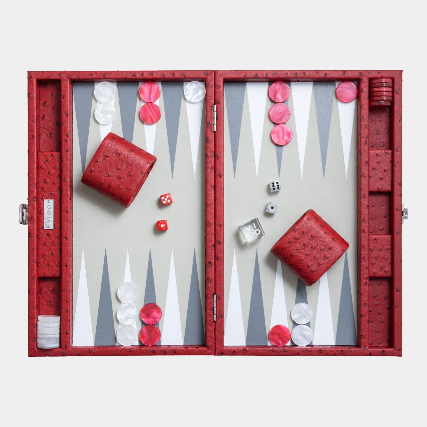 Backgammon set with red and white pieces on a light gray background by VIDO